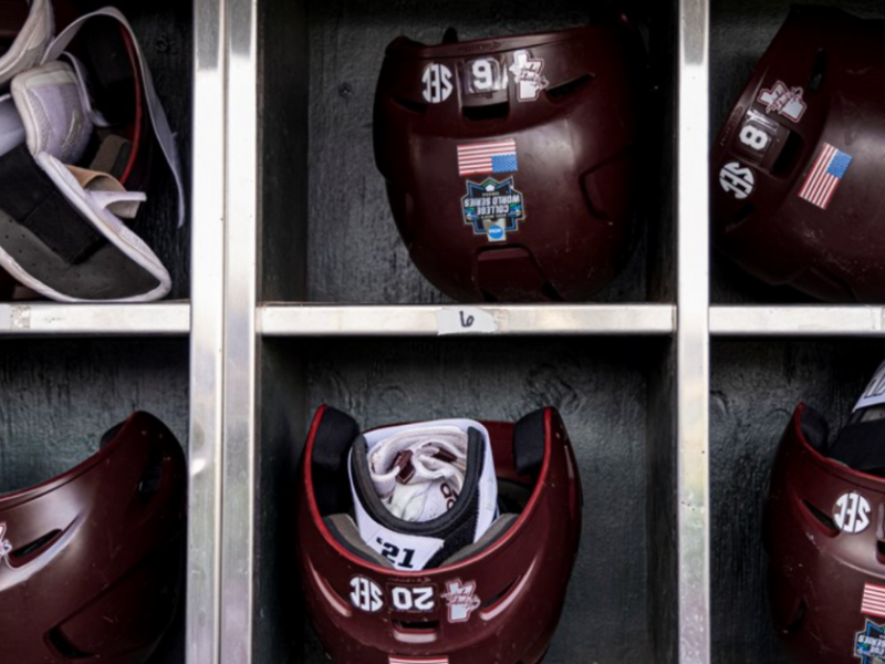 OMAHA, NE - June 25, 2021 - Batting helmets in the dugout before the 2021 Mens College World Series semifinal round game between the Texas Longhorns and the Mississippi State Bulldogs at TD Ameritrade Park in Omaha, NE. Photo By Austin Perryman