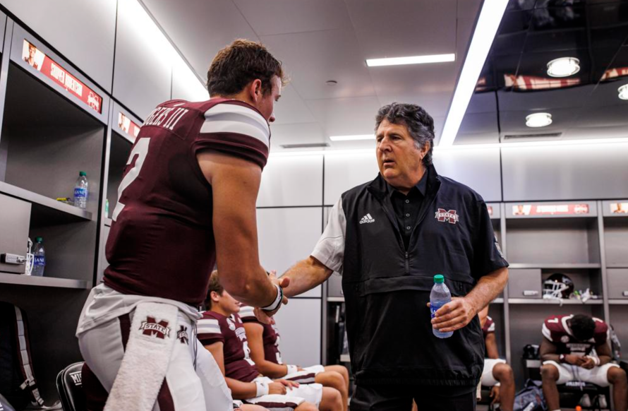 Mississippi State football coach Mike Leach and quarterback Will Rogers shake hands prior to Bulldogs' game against Memphis Tigers at Davis Wade Stadium at Scott Field.